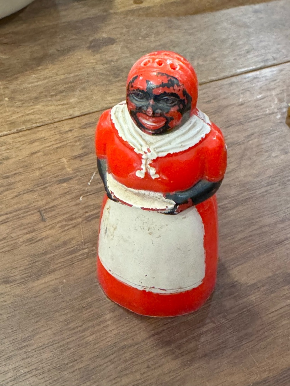 Vintage 1950s Black Americana molded red plastic shaker  3.5 inches tall.